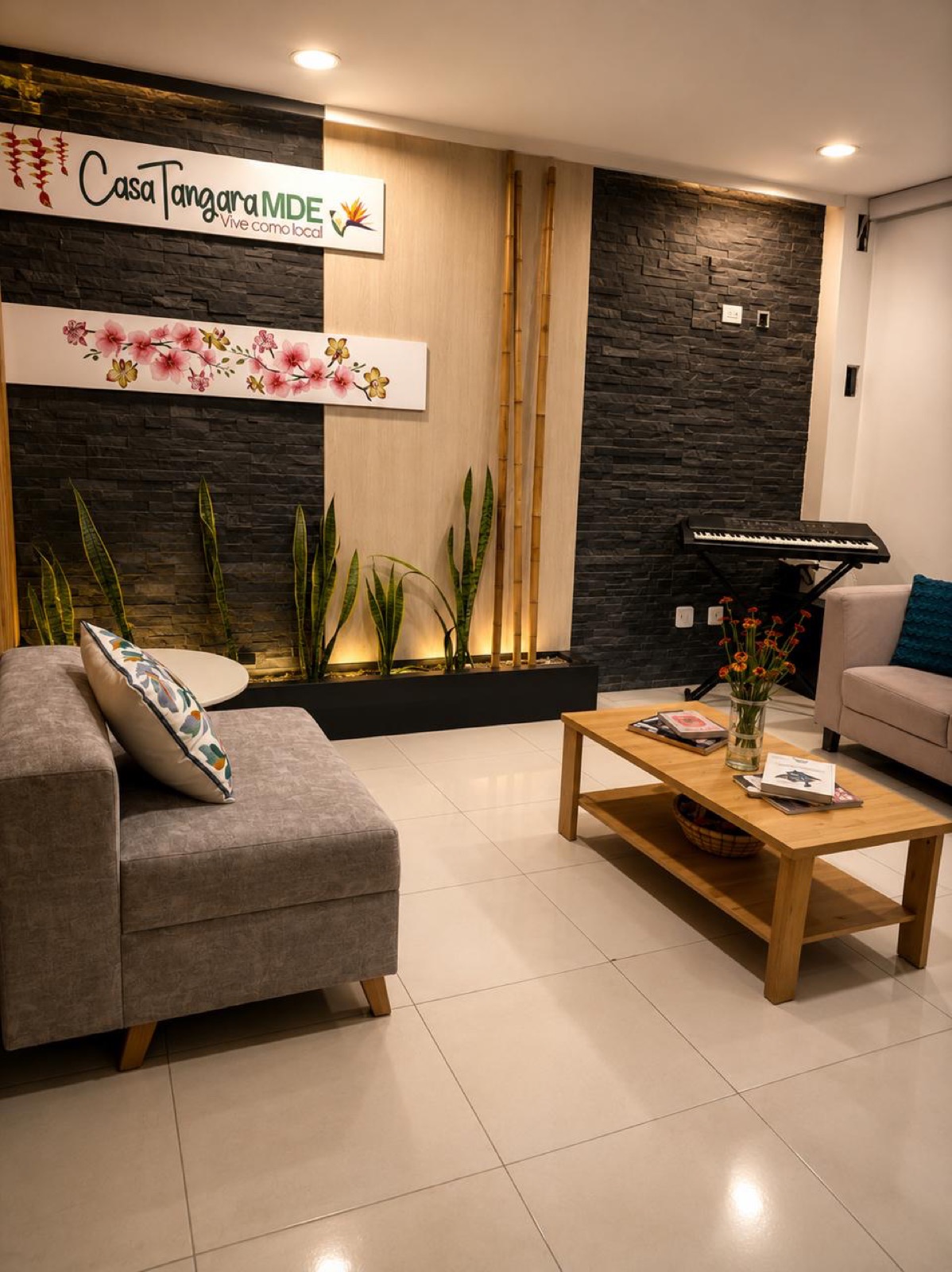 Casa Café lobby with Casa Tángara MDE sign, plants and cozy seating